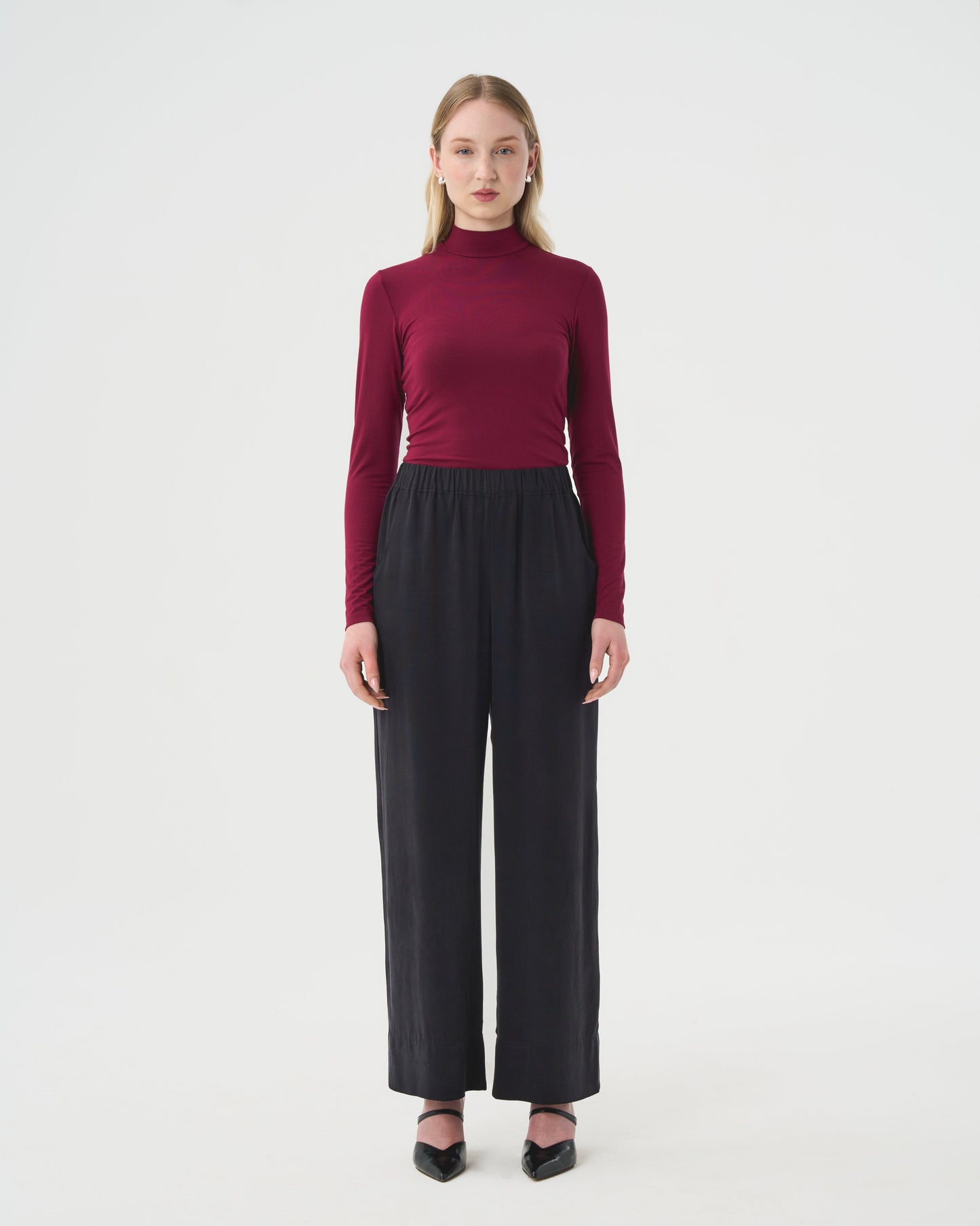 Wide black pants for women with elastic waistband. DV Bourgogne log sleeve turtleneck top for women. 